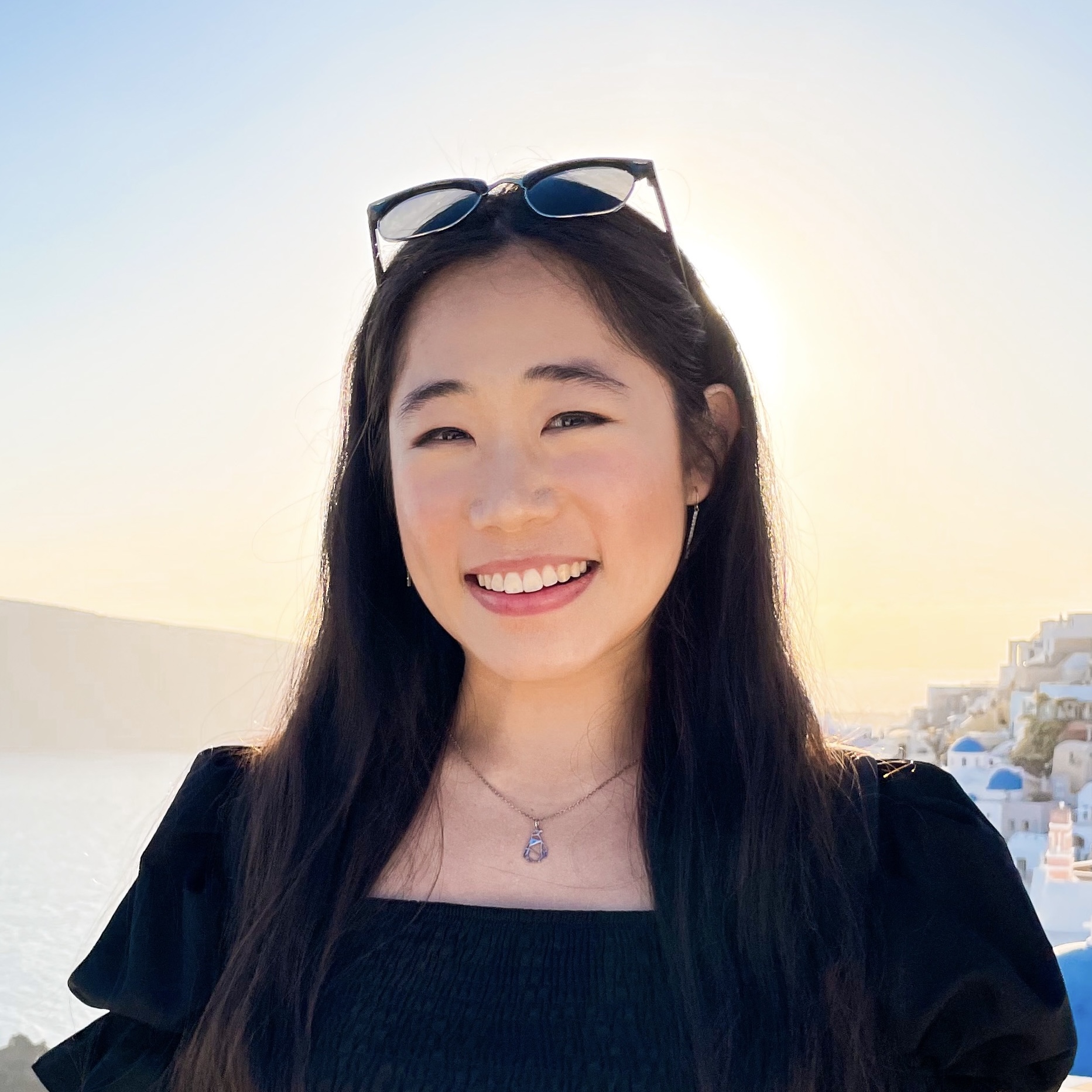 Headshot of Lucy Jiang, a Chinese American woman wearing a black shirt.